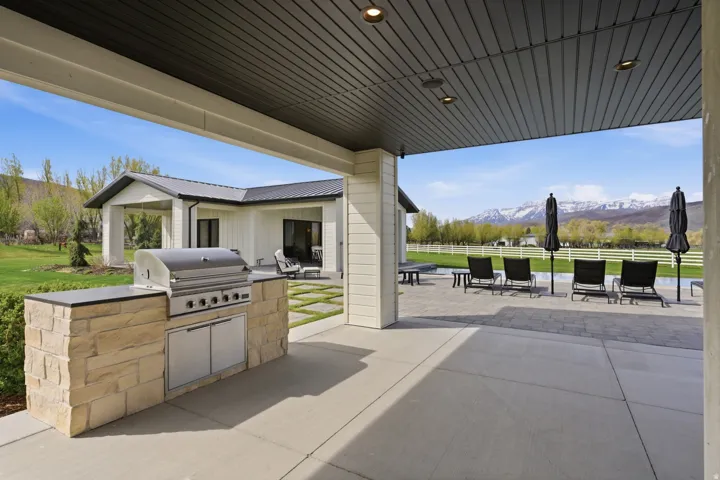View of patio featuring a mountain view and an outdoor kitchen