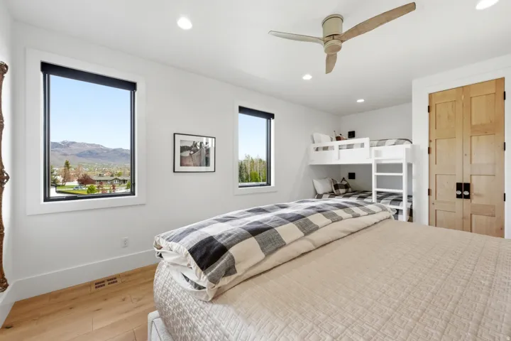 Bedroom featuring light wood finished floors, recessed lighting, and ceiling fan
