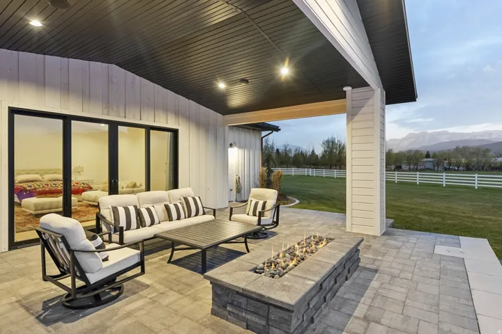 View of patio / terrace with a mountain view and an outdoor living space with a fire pit