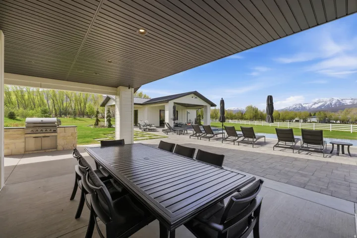 View of patio featuring a mountain view and an outdoor kitchen / dining area