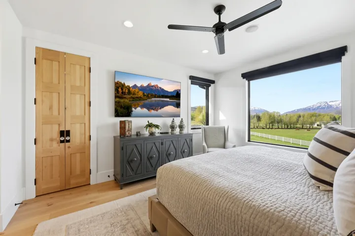 Bedroom featuring wood finished floors, recessed lighting, and ceiling fan