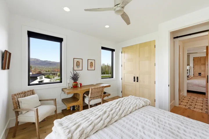 Bedroom with a closet, light wood finished floors, ceiling fan, and recessed lighting