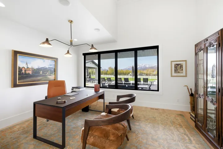 Office featuring baseboards and a mountain view