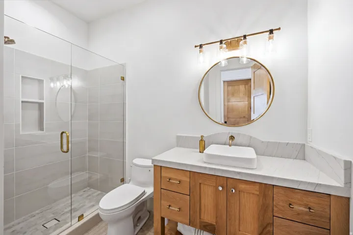 Bathroom with vanity and a stall shower