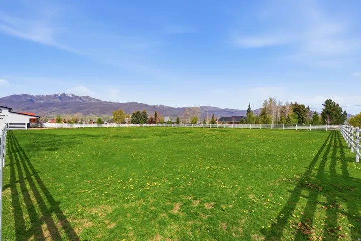 View of yard with a view of countryside and a mountain view