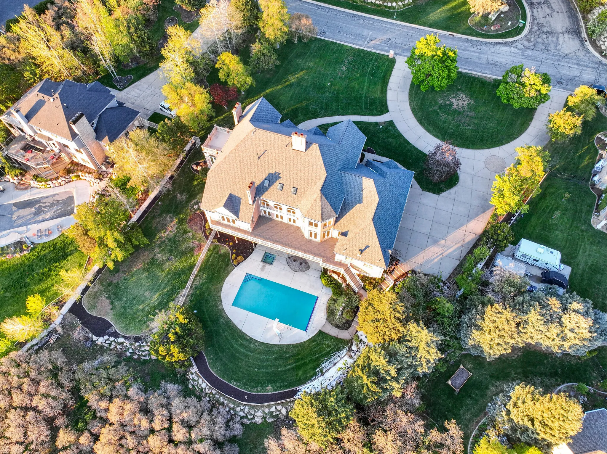 Aerial view of property and surrounding area featuring a pool