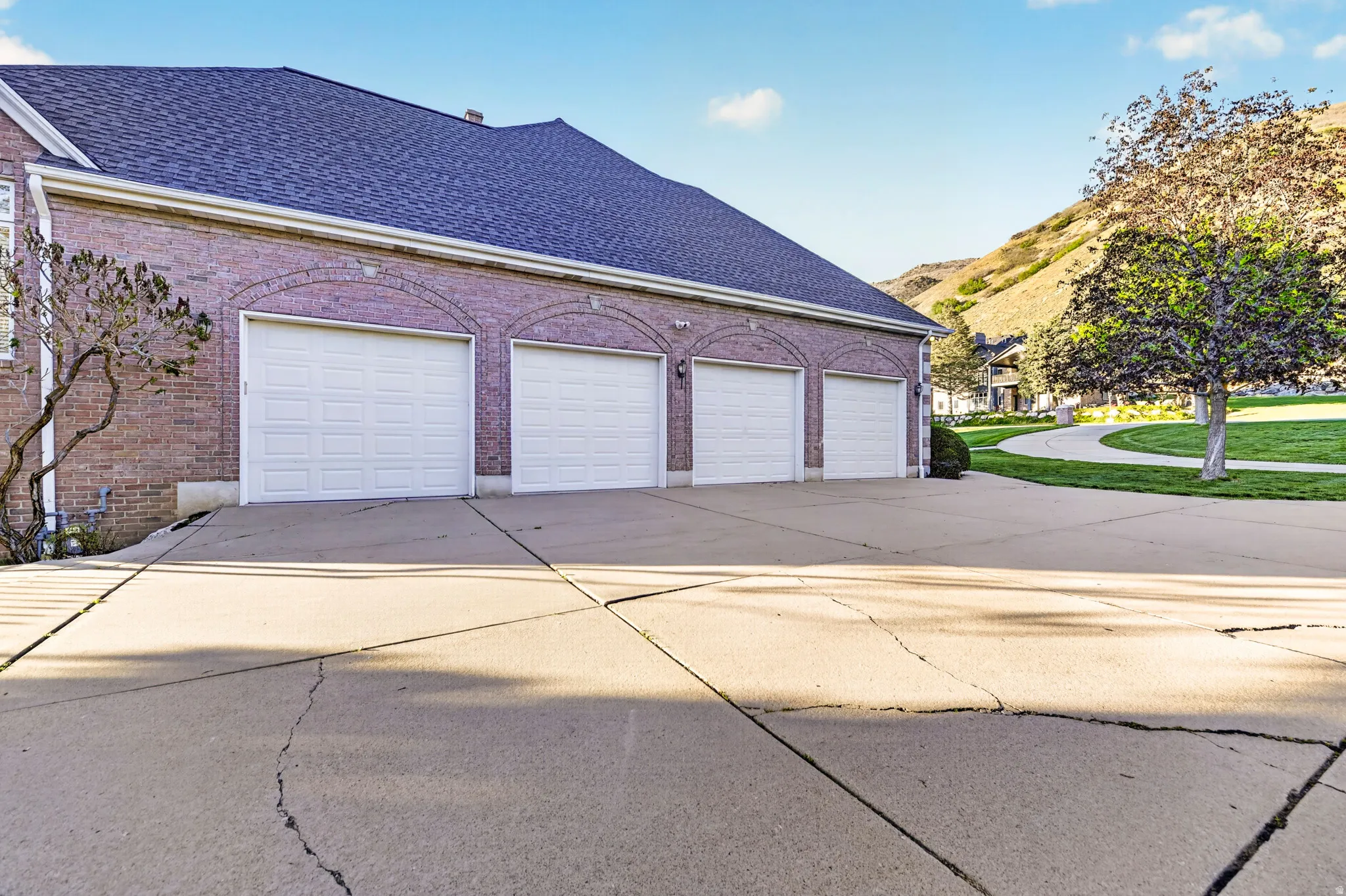 Garage featuring concrete driveway