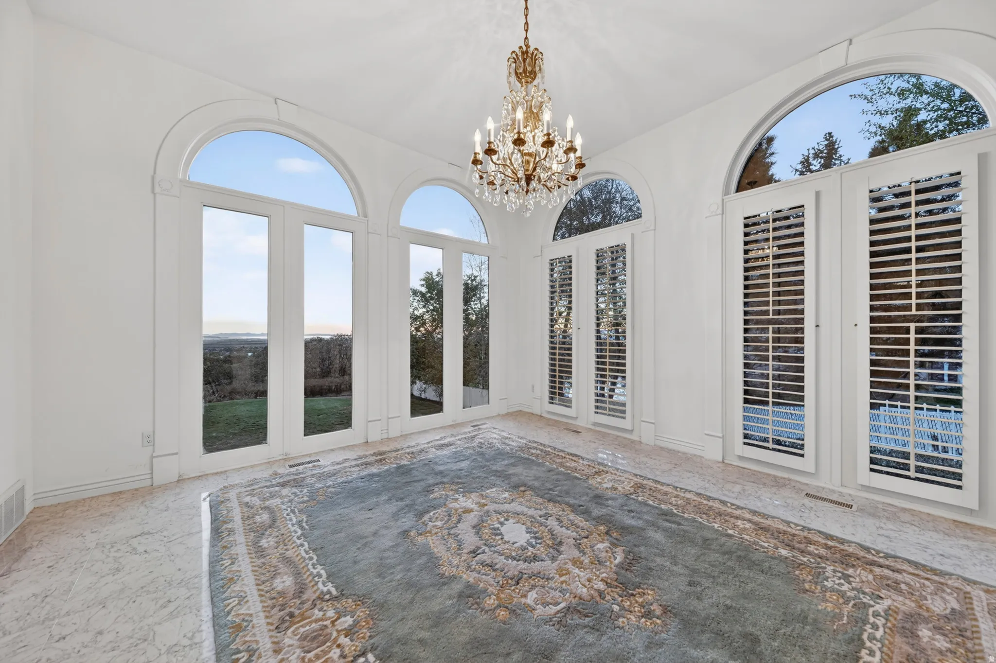 Solarium with french doors and chandelier