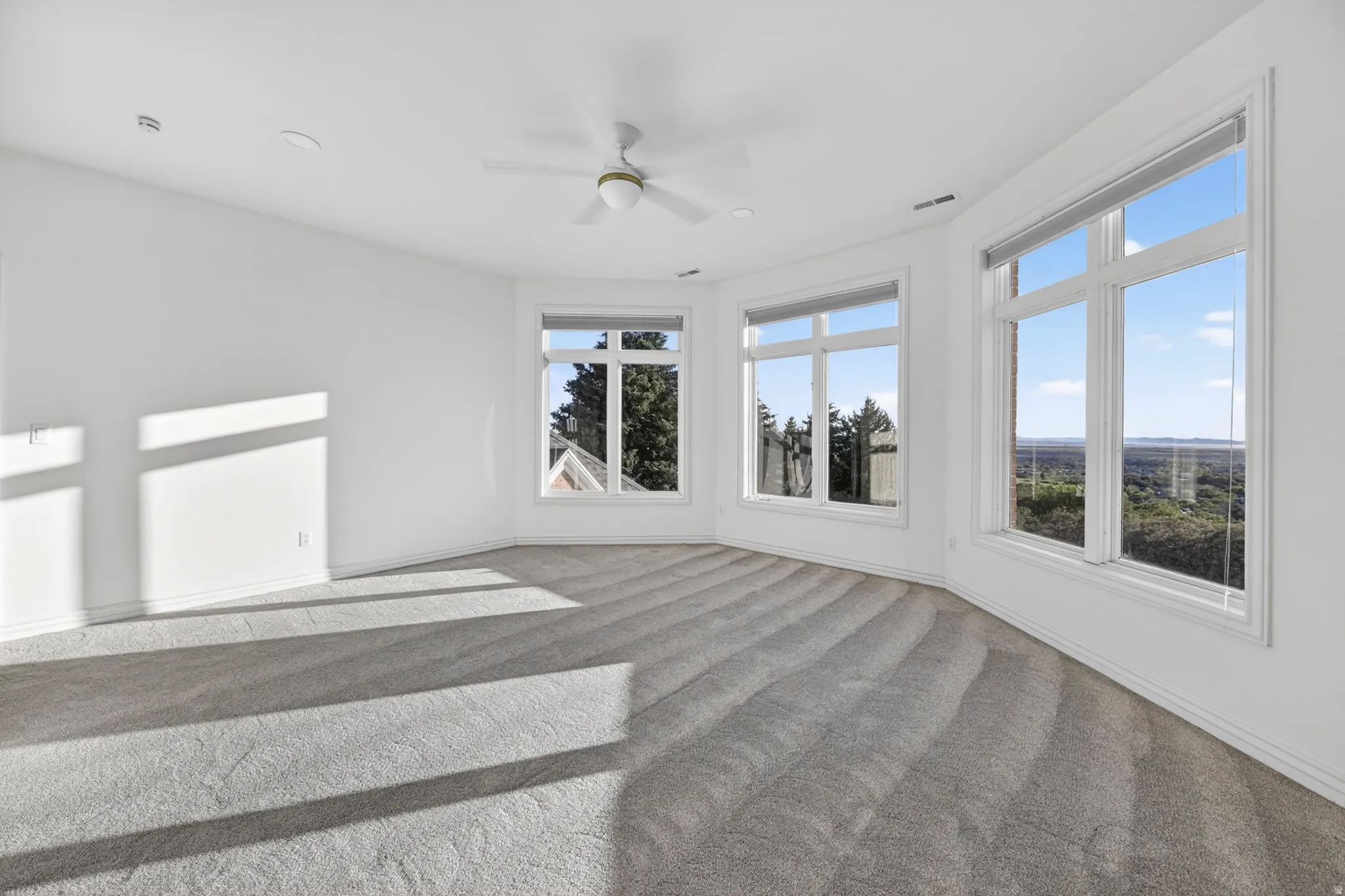 Bedroom with ceiling fan, recessed lighting, and carpet