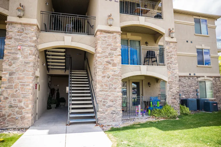 View of apartment building / complex featuring stairs