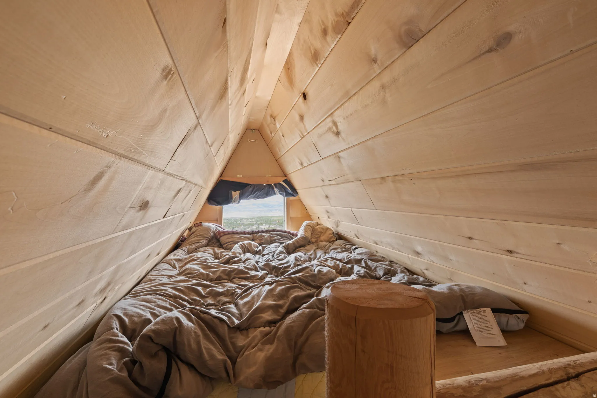 3rd level loft with bed and window