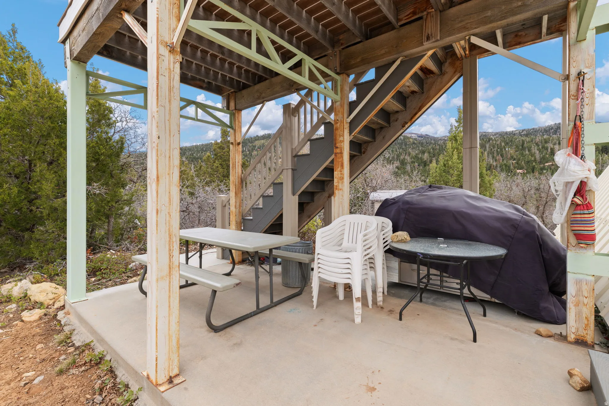 View of patio featuring outdoor dining area and a grill