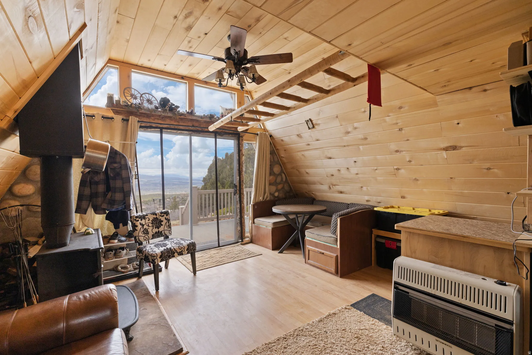 Main level with family room, dining area and wood burning stove