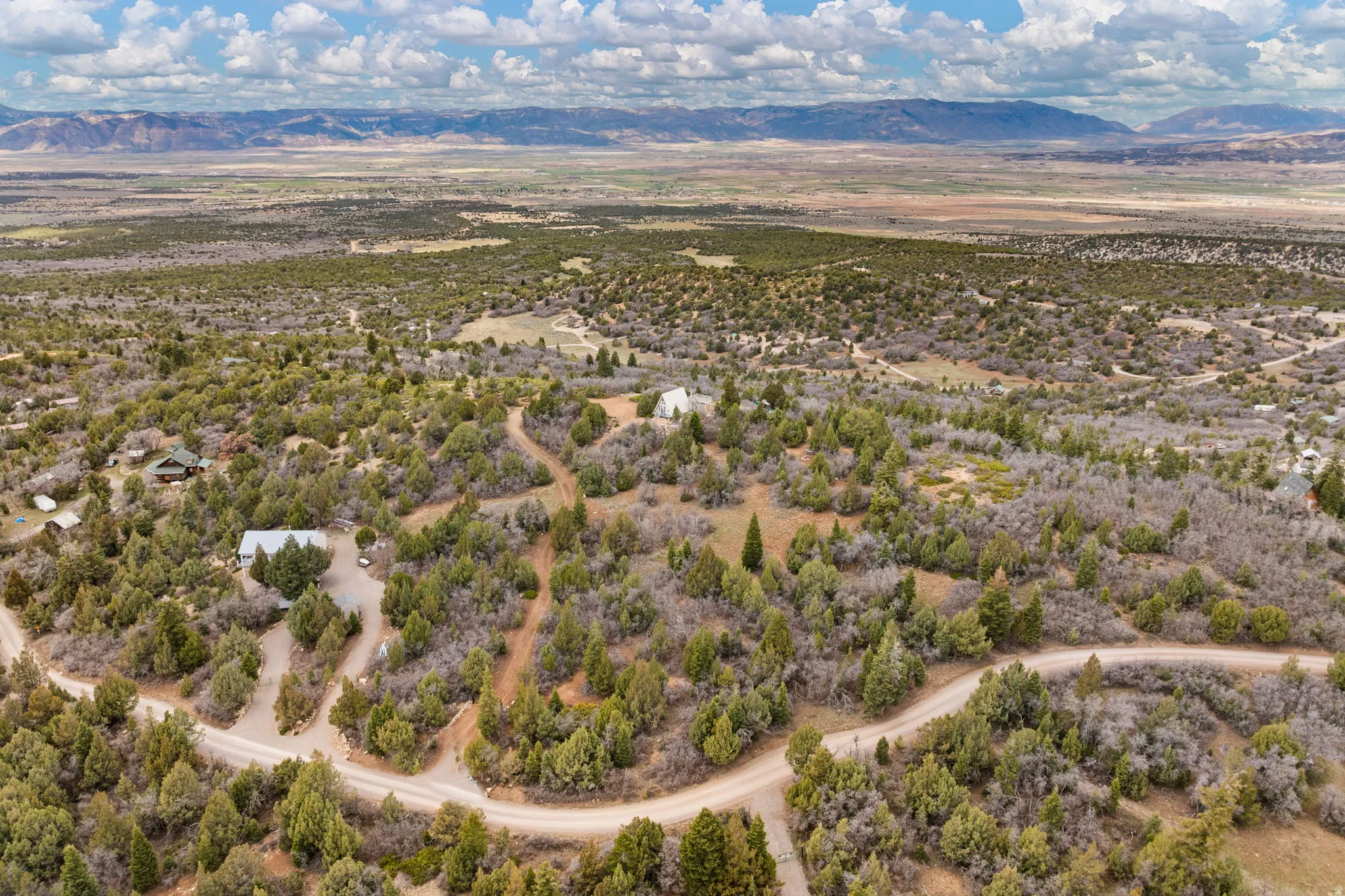 Aerial view of sparsely populated area featuring a mountain backdrop