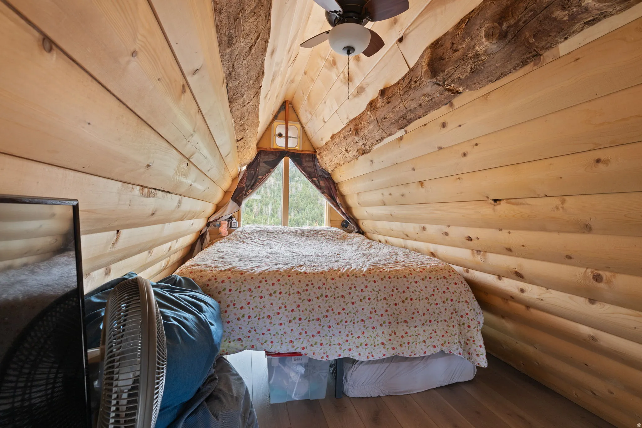 Loft with large bed and viewing window