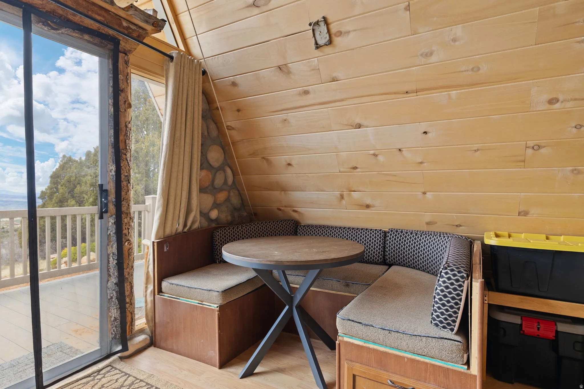 Main level with family room, dining area and wood burning stove