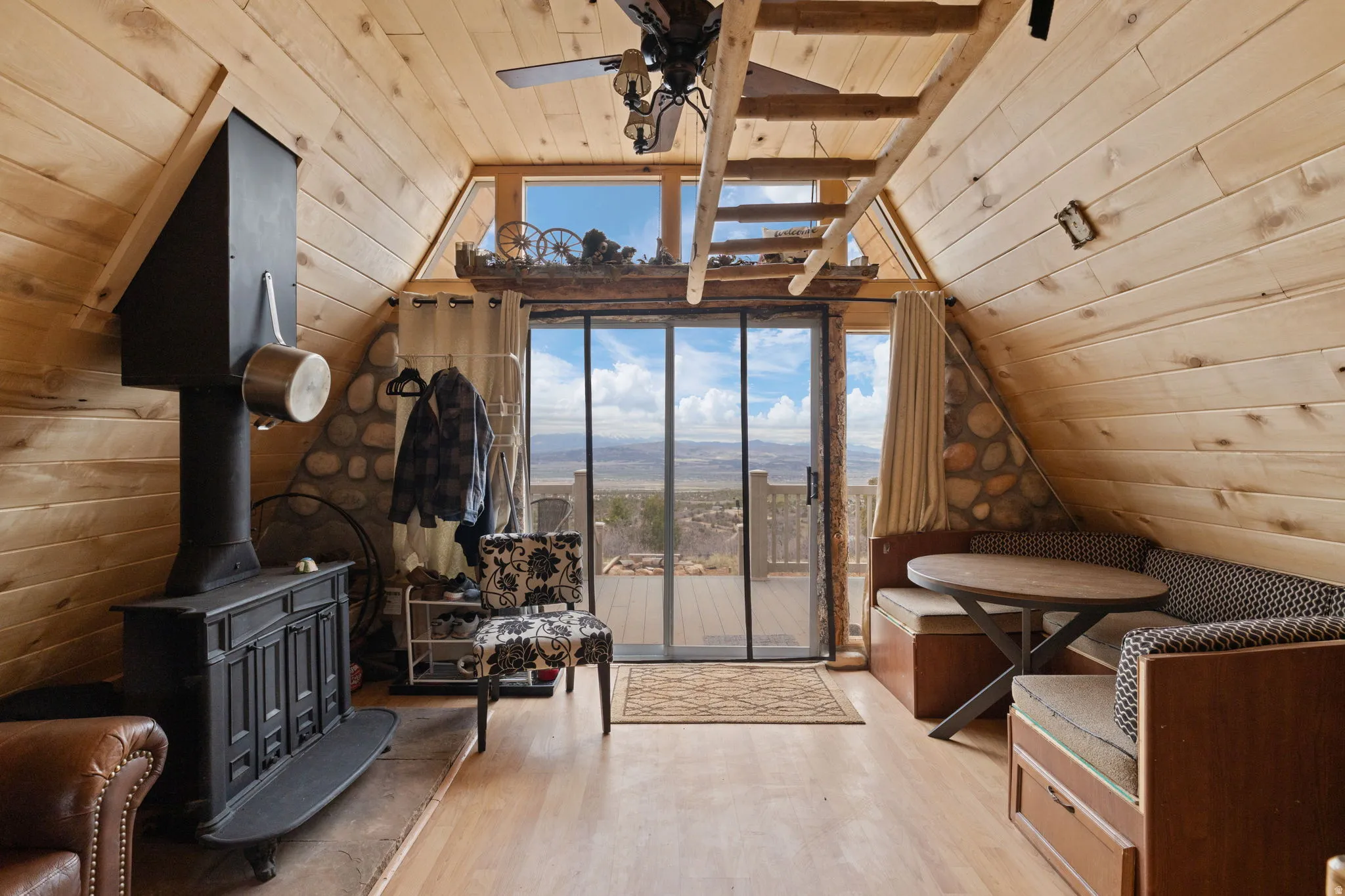 Main level with family room, dining area and wood burning stove