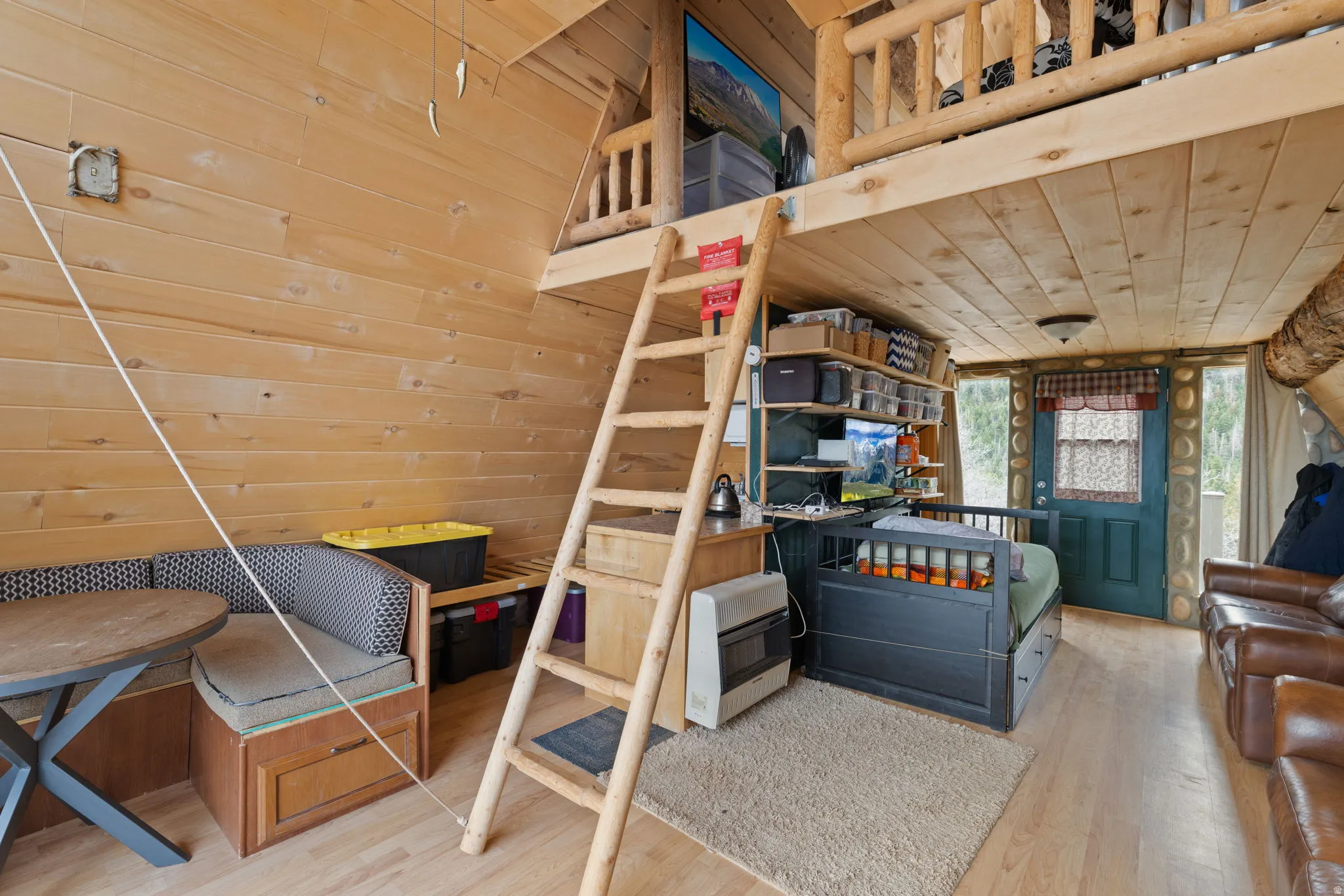 Main level with family room, dining area and wood burning stove