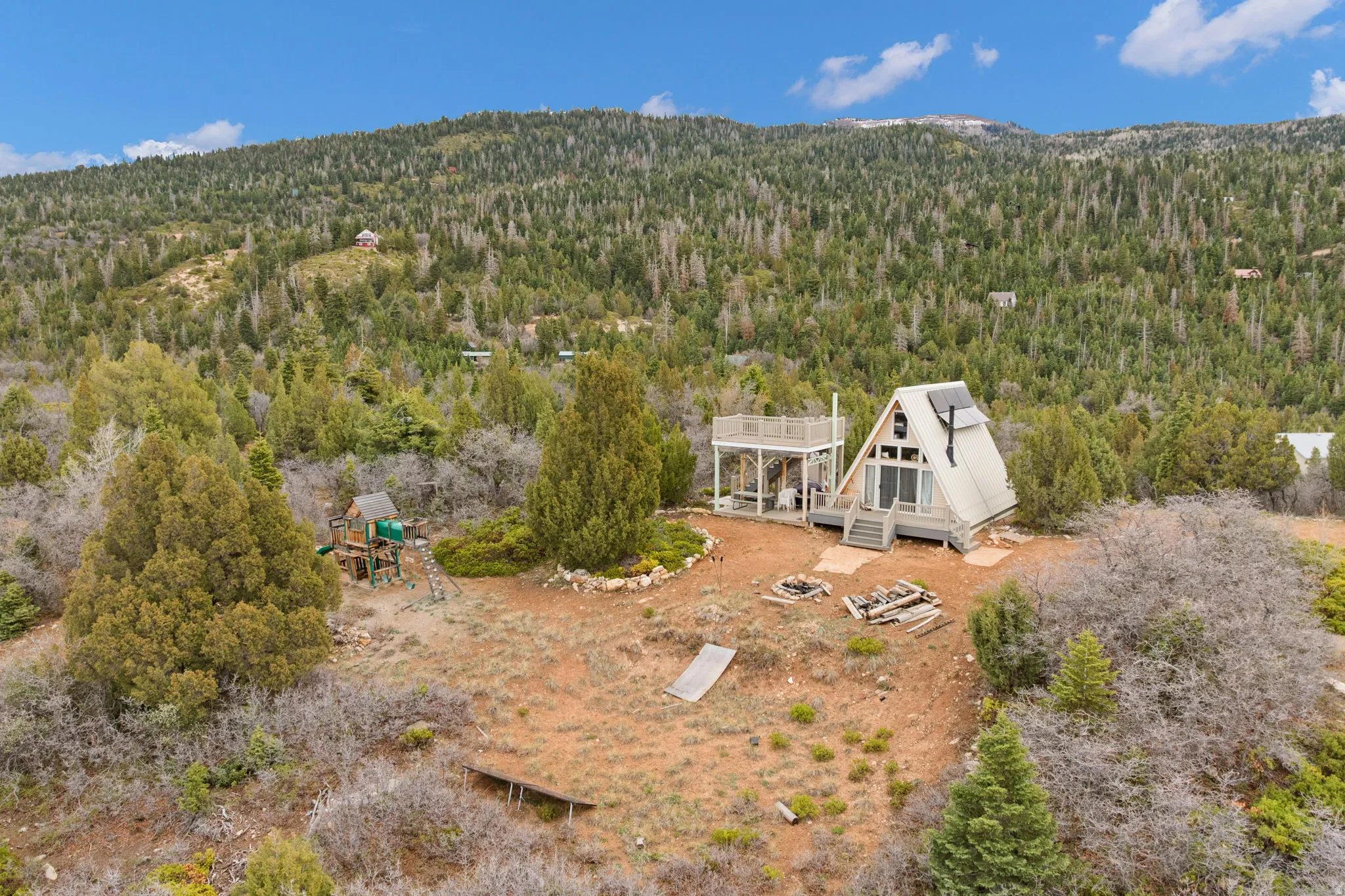 View of subject property with a heavily wooded area