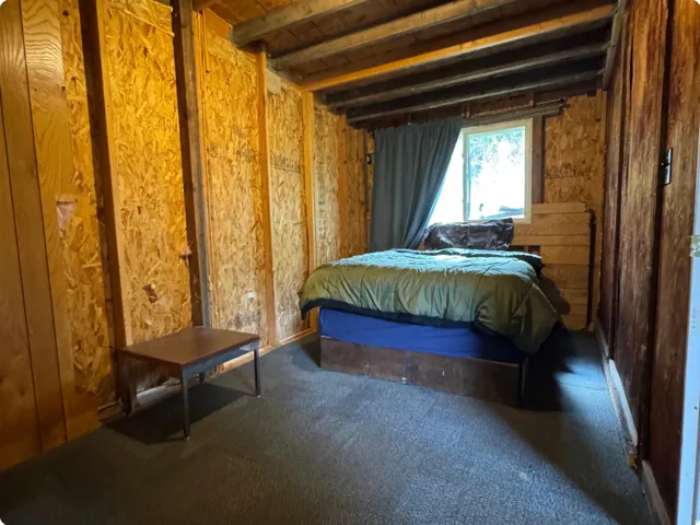 Bedroom with dark carpet