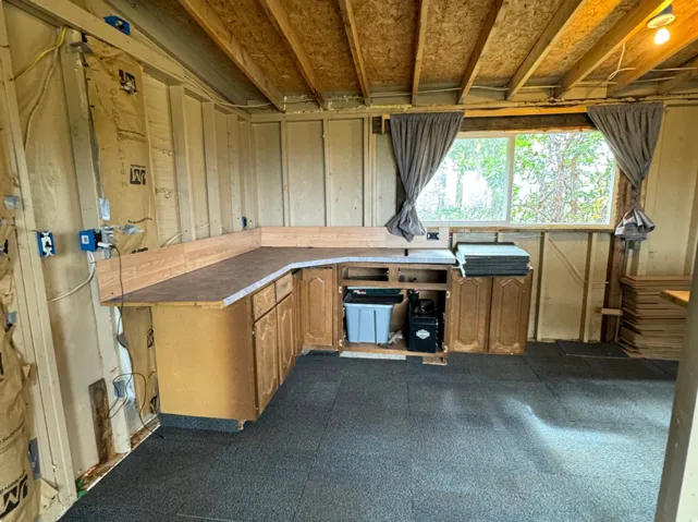 Bar area featuring wood finish cabinetry and light countertops