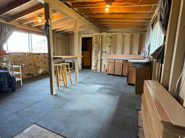 Miscellaneous room featuring lofted ceiling