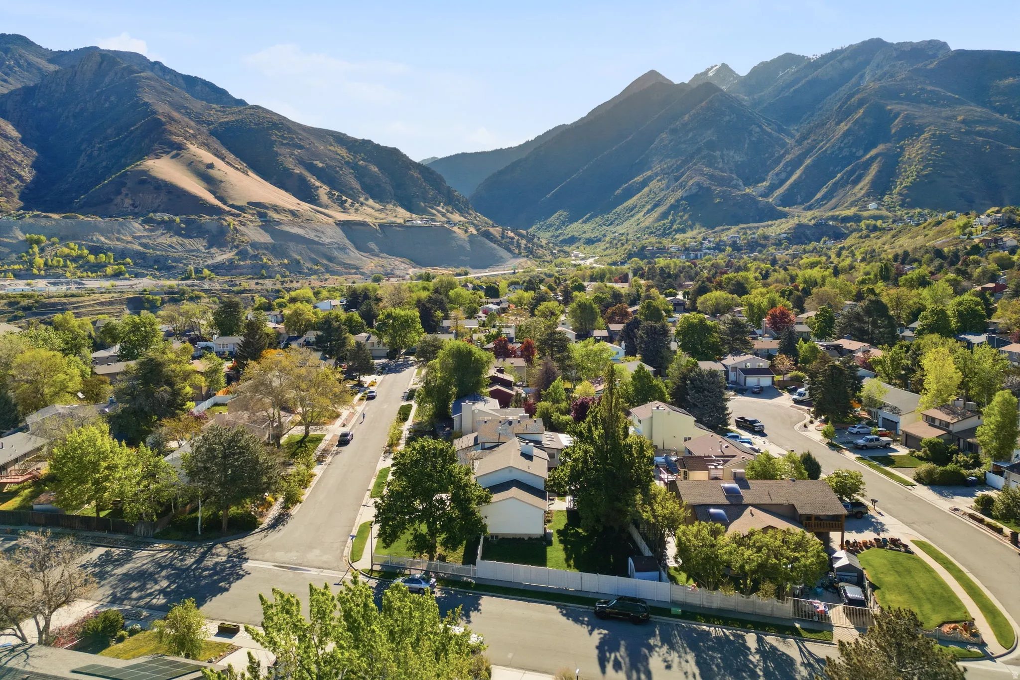 Aerial view of residential area featuring mountains