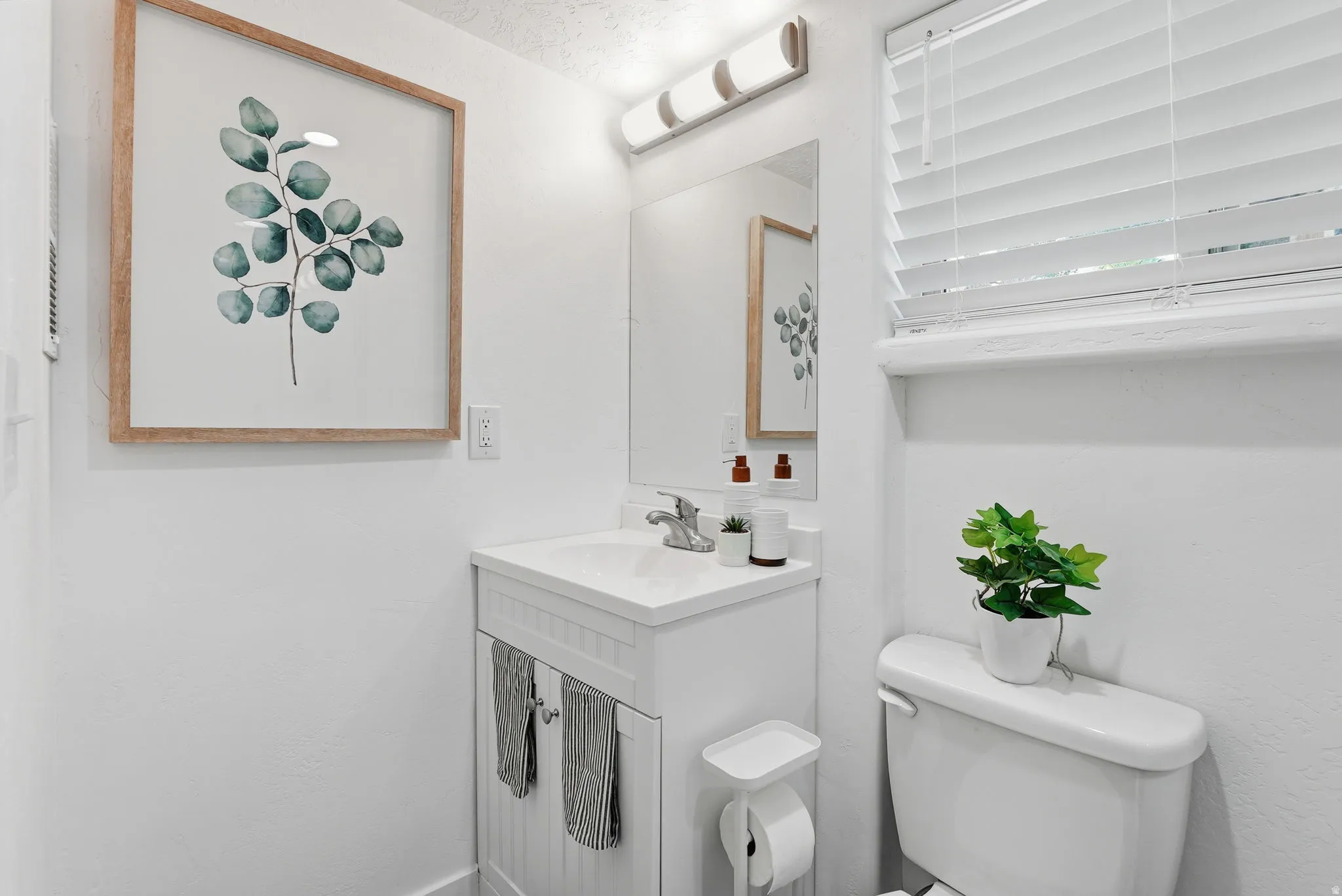 Half bath with toilet and vanity