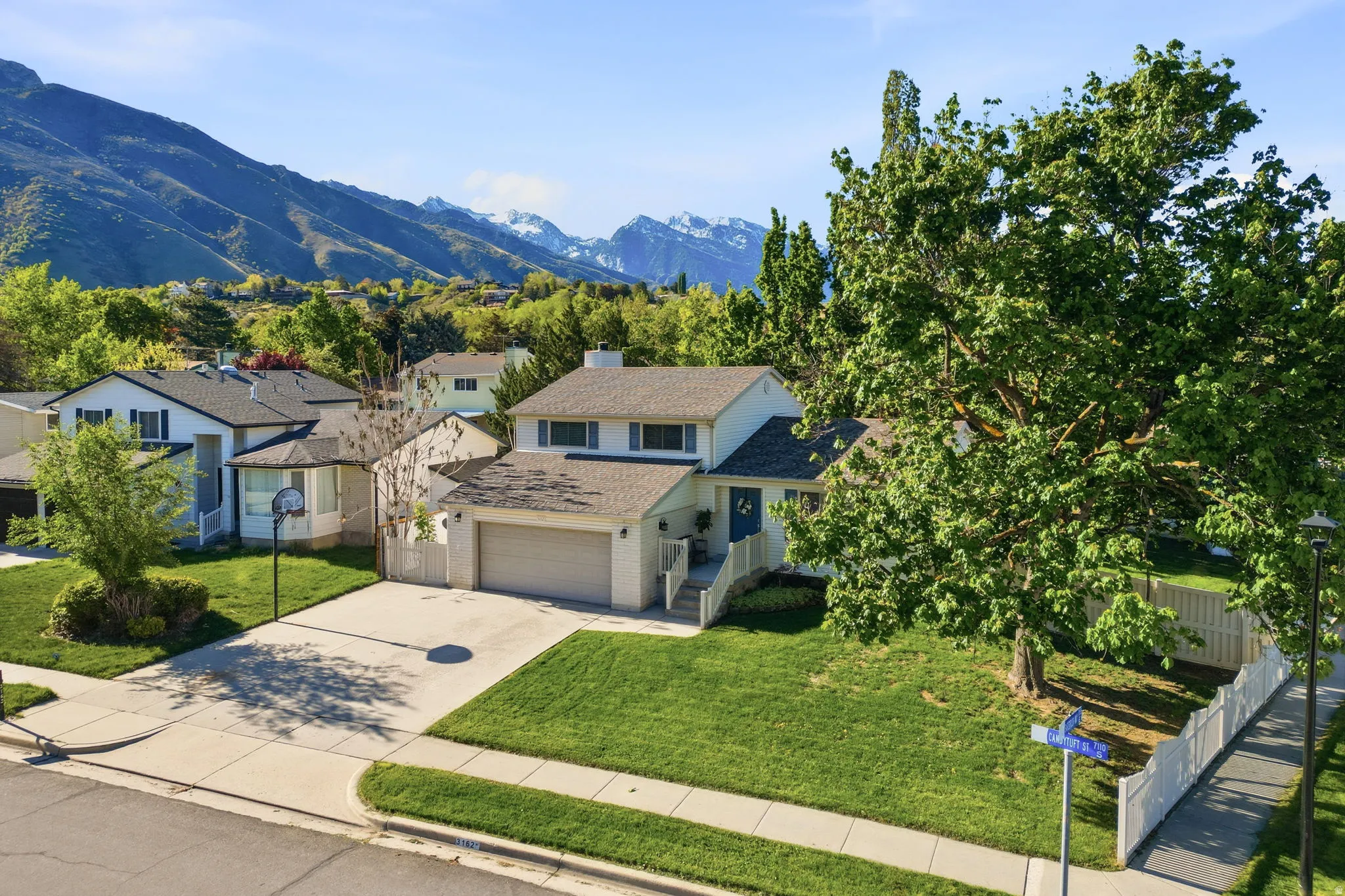 Traditional-style house with driveway, a mountain view, and a garage