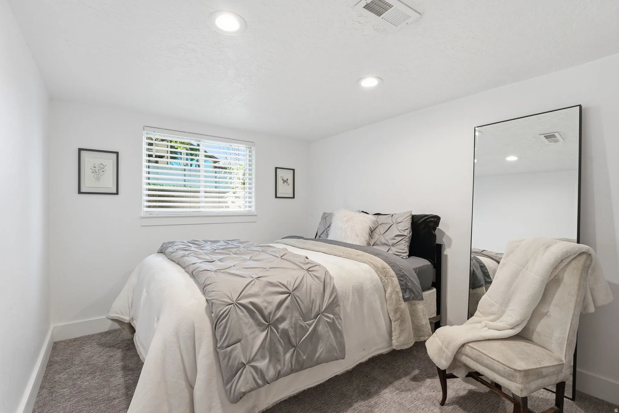 Bedroom with carpet floors and recessed lighting