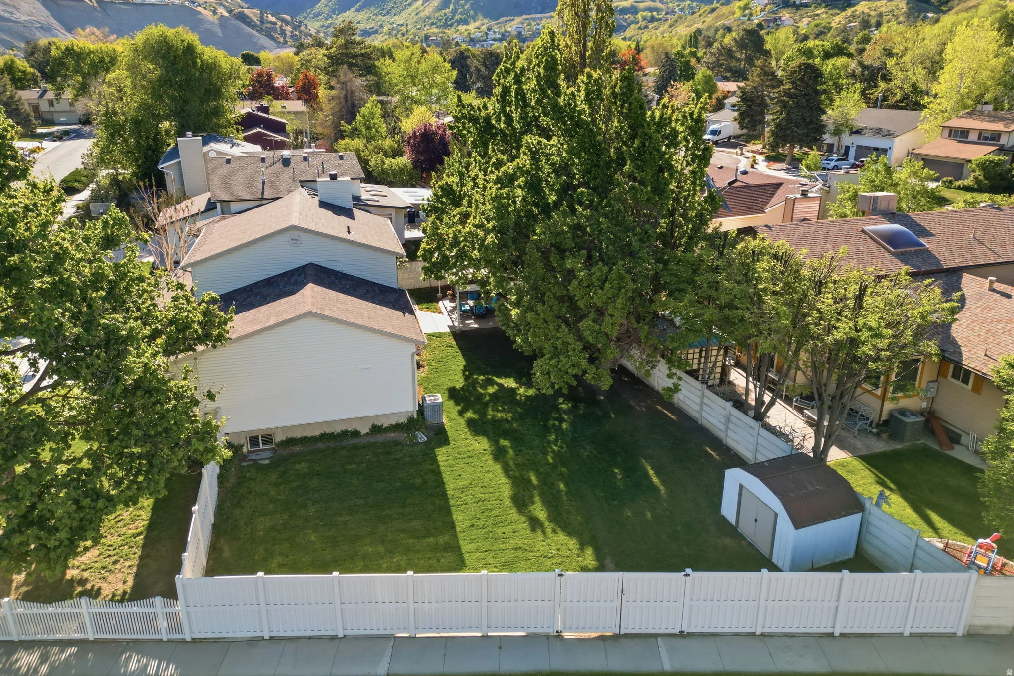 Aerial perspective of suburban area featuring a mountainous background
