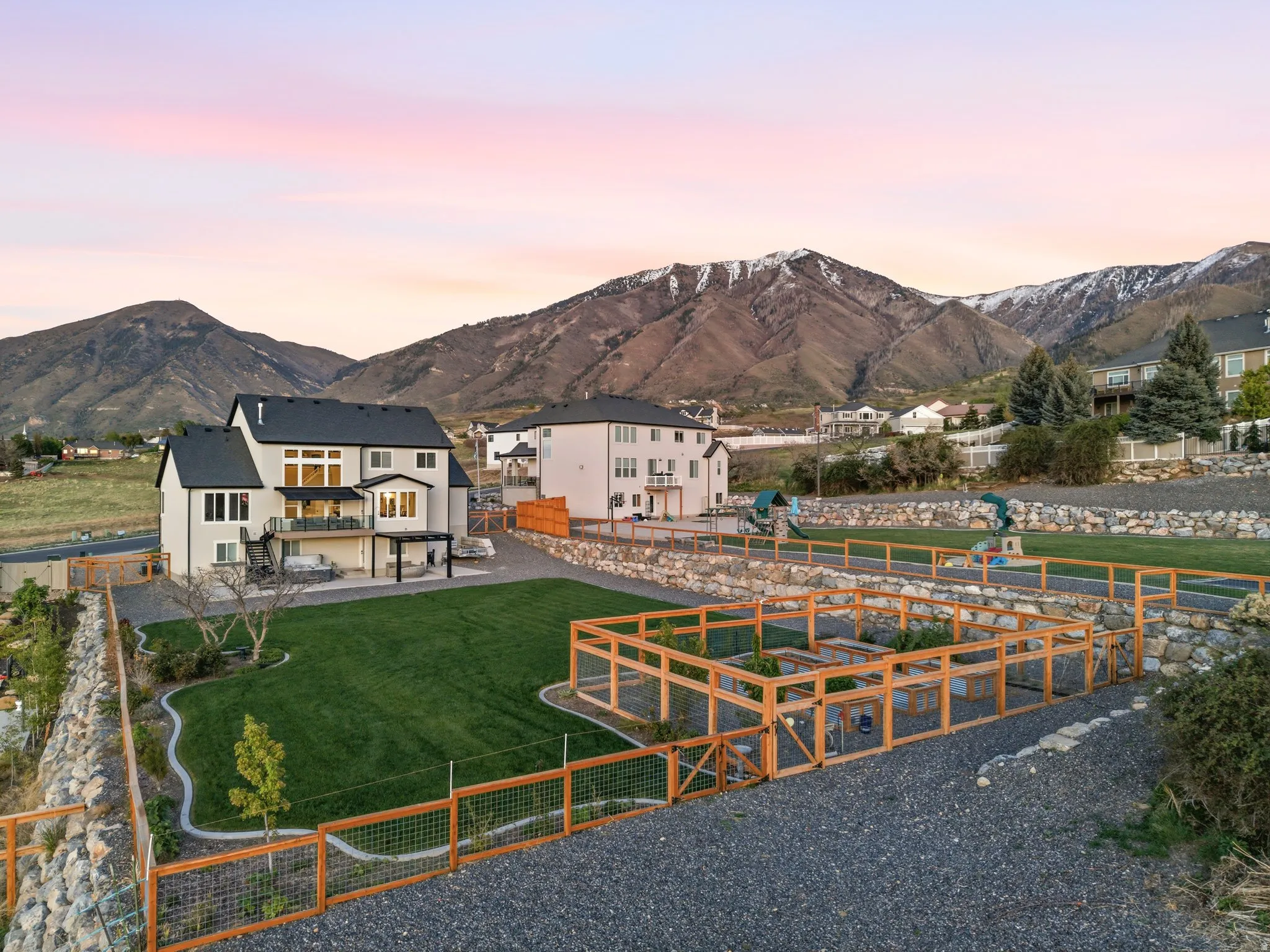 View of community with a fenced backyard, a mountain view, and a residential view
