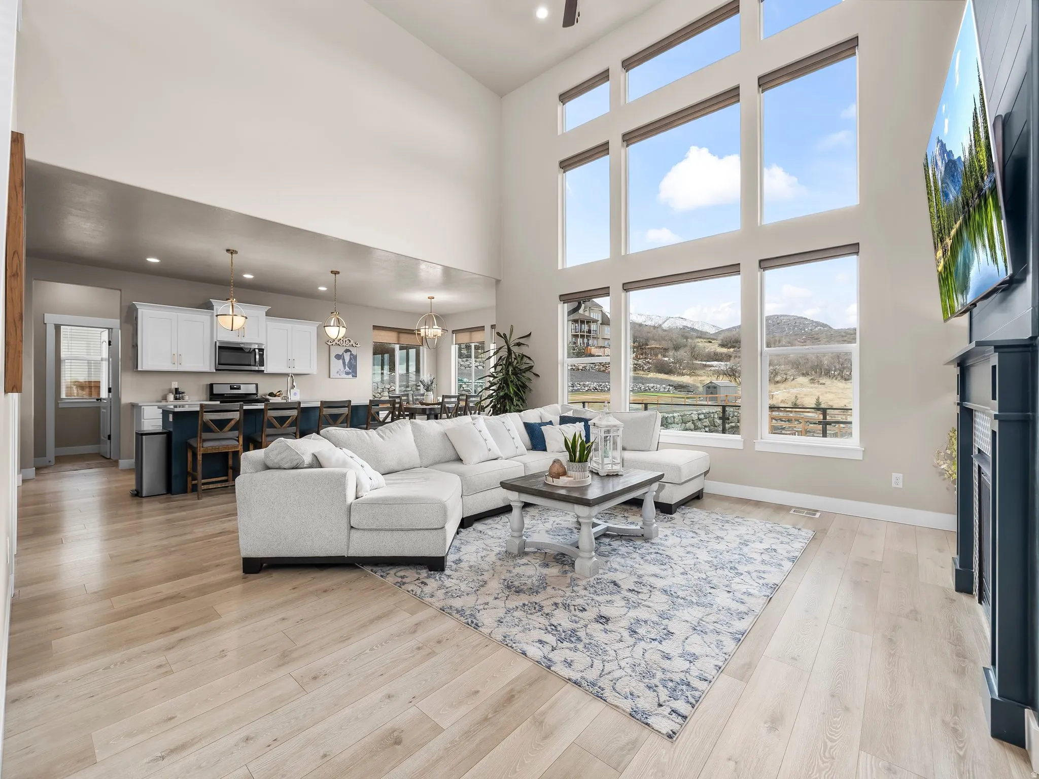 Great room with large windows and electric shades!