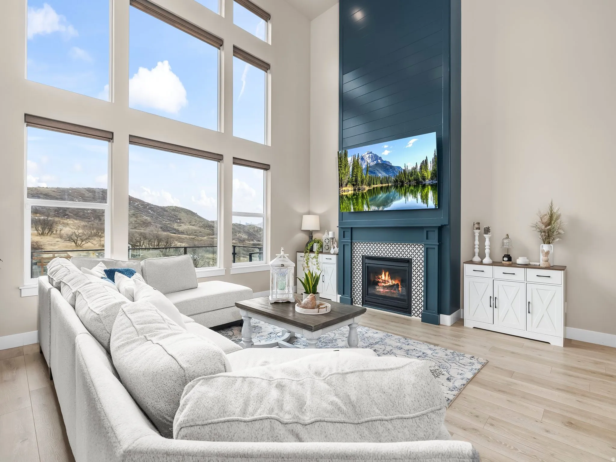 Large great room with views of the backyard. Large gas fire place