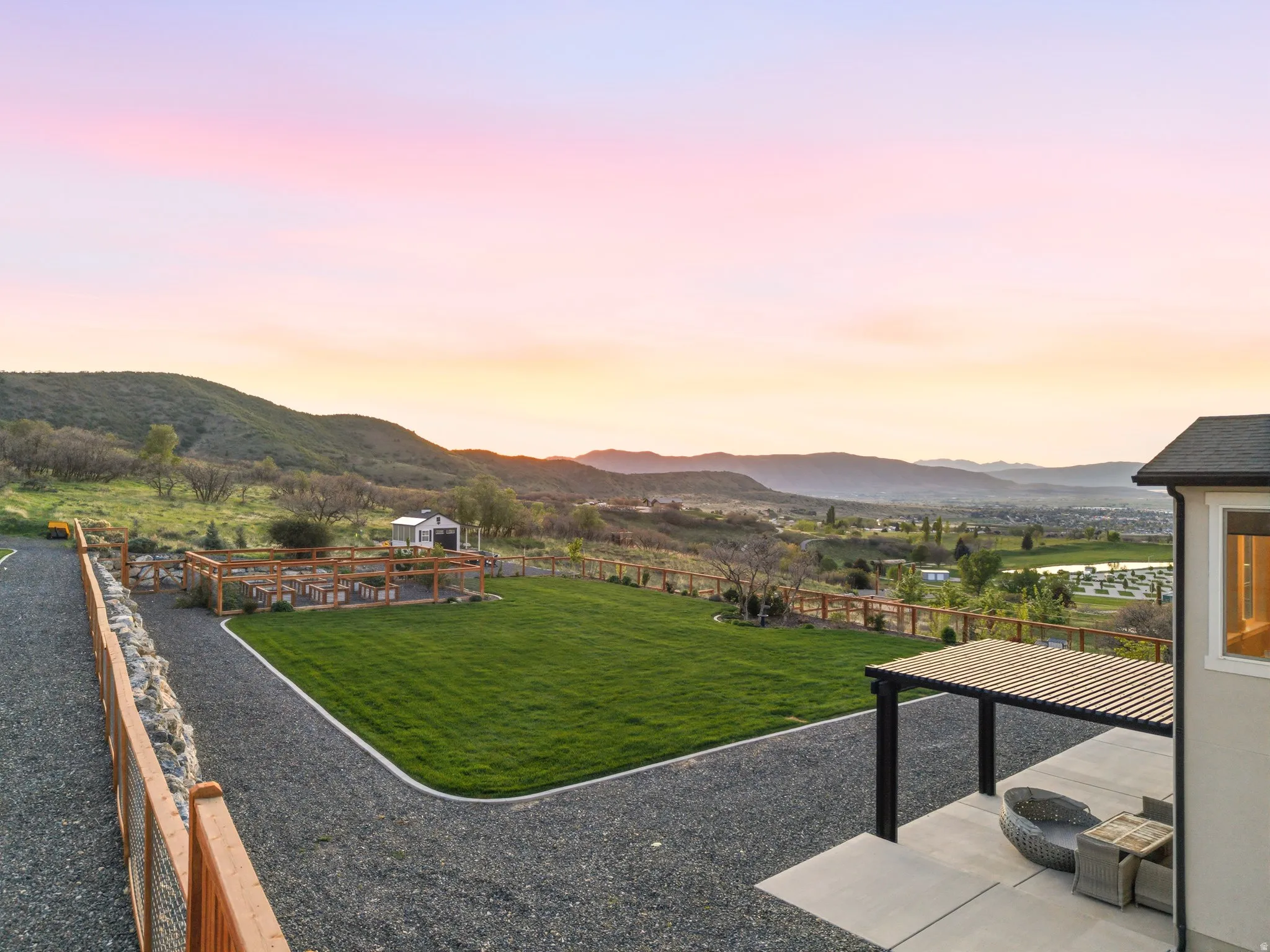 Yard at dusk featuring a yard and a mountain view