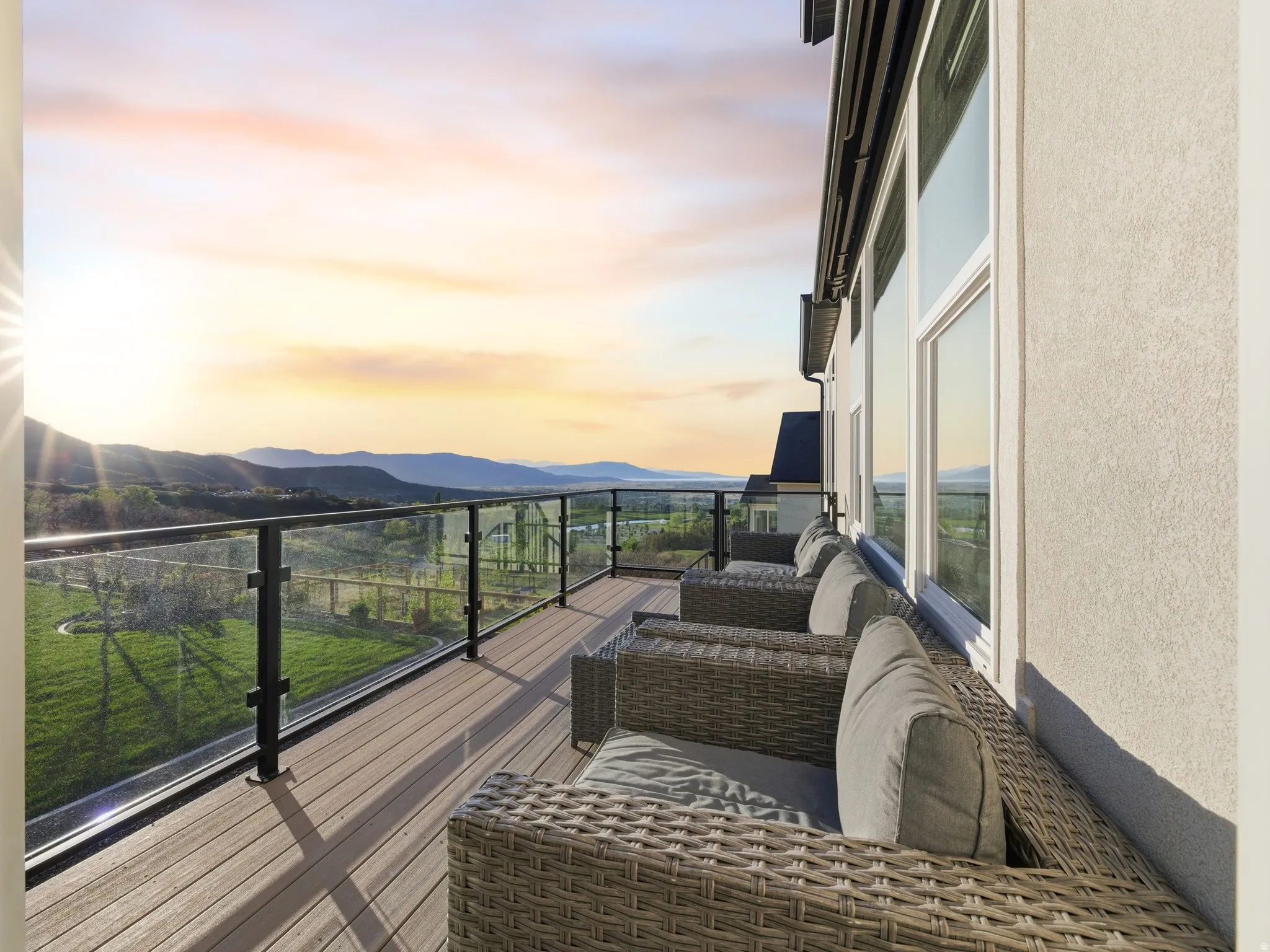 Balcony at dusk featuring a mountain view