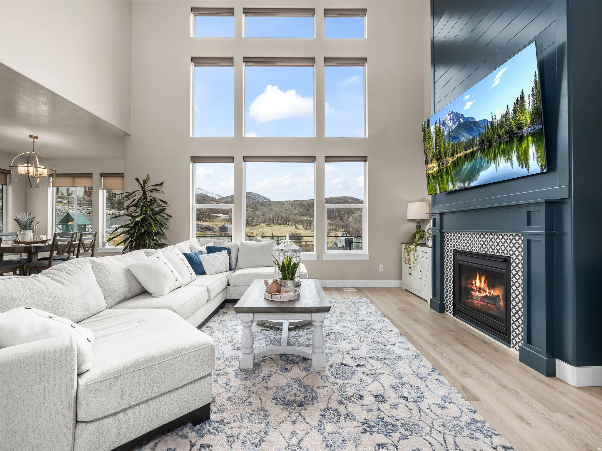 Large great room with views of the backyard. Large gas fire place