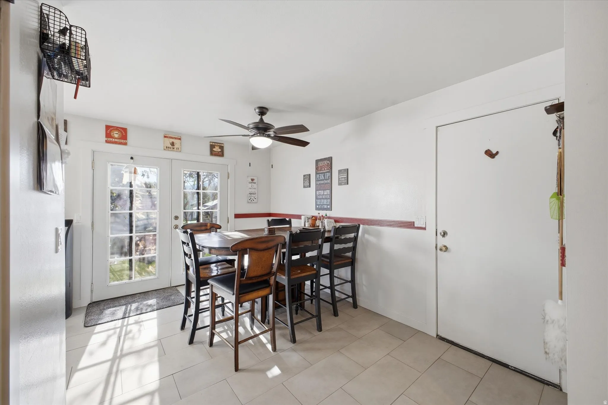 Dining room with french doors and ceiling fan