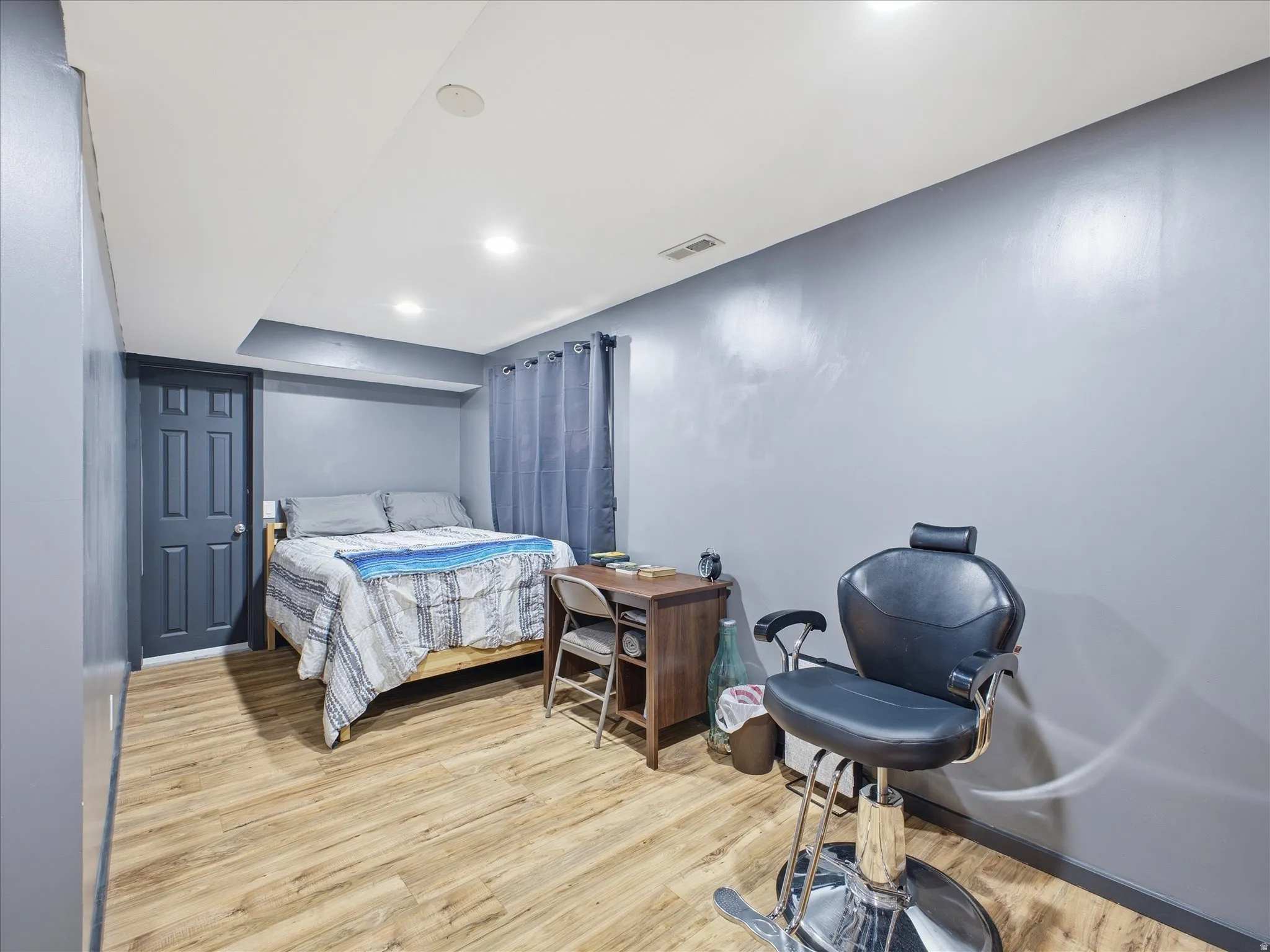 Bedroom with light wood-style flooring and recessed lighting