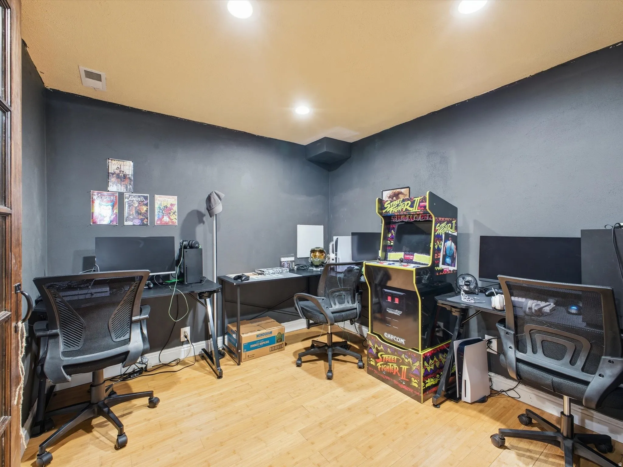 Home office featuring light wood-style floors and recessed lighting