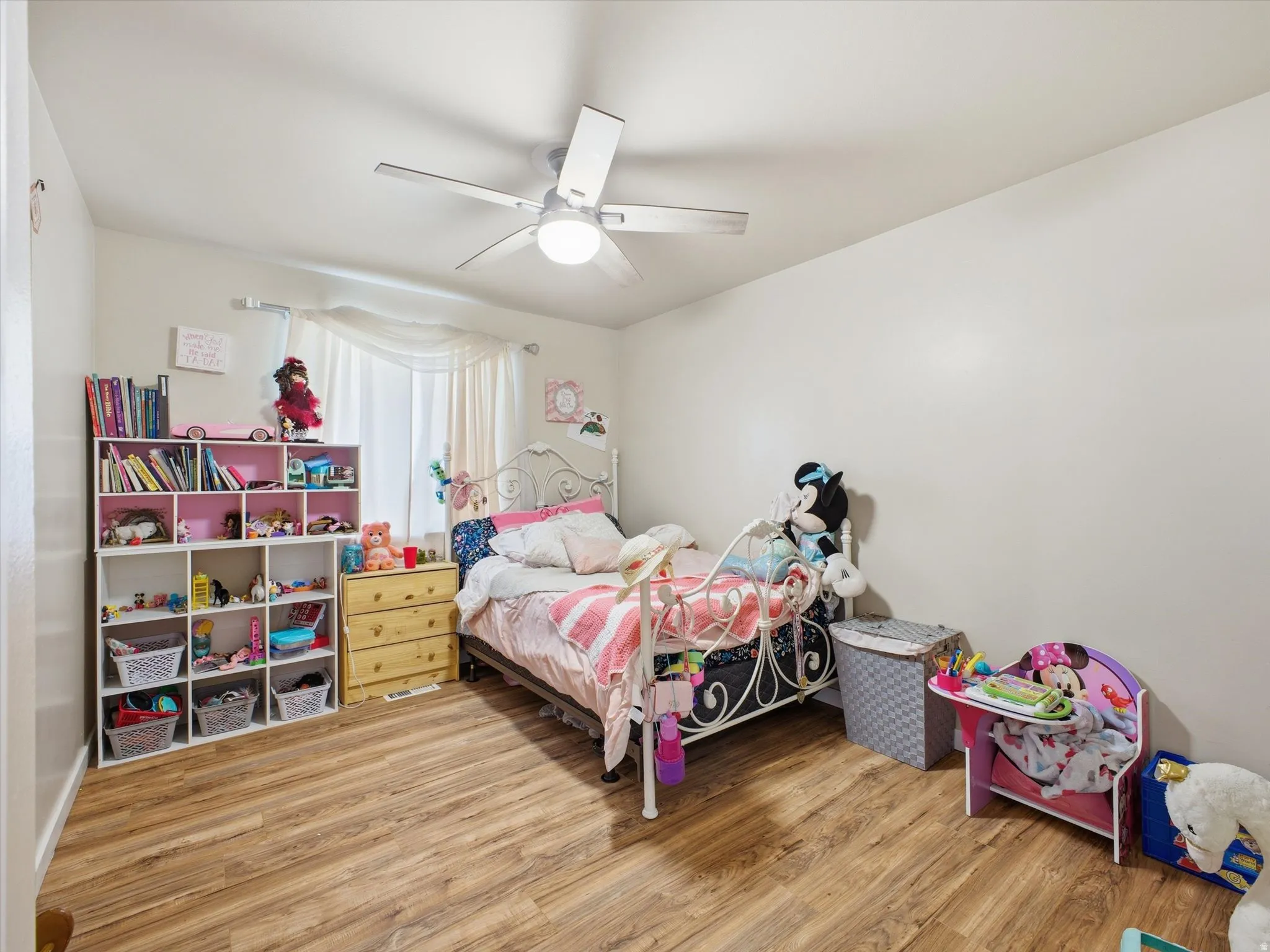 Bedroom featuring light wood-type flooring and ceiling fan