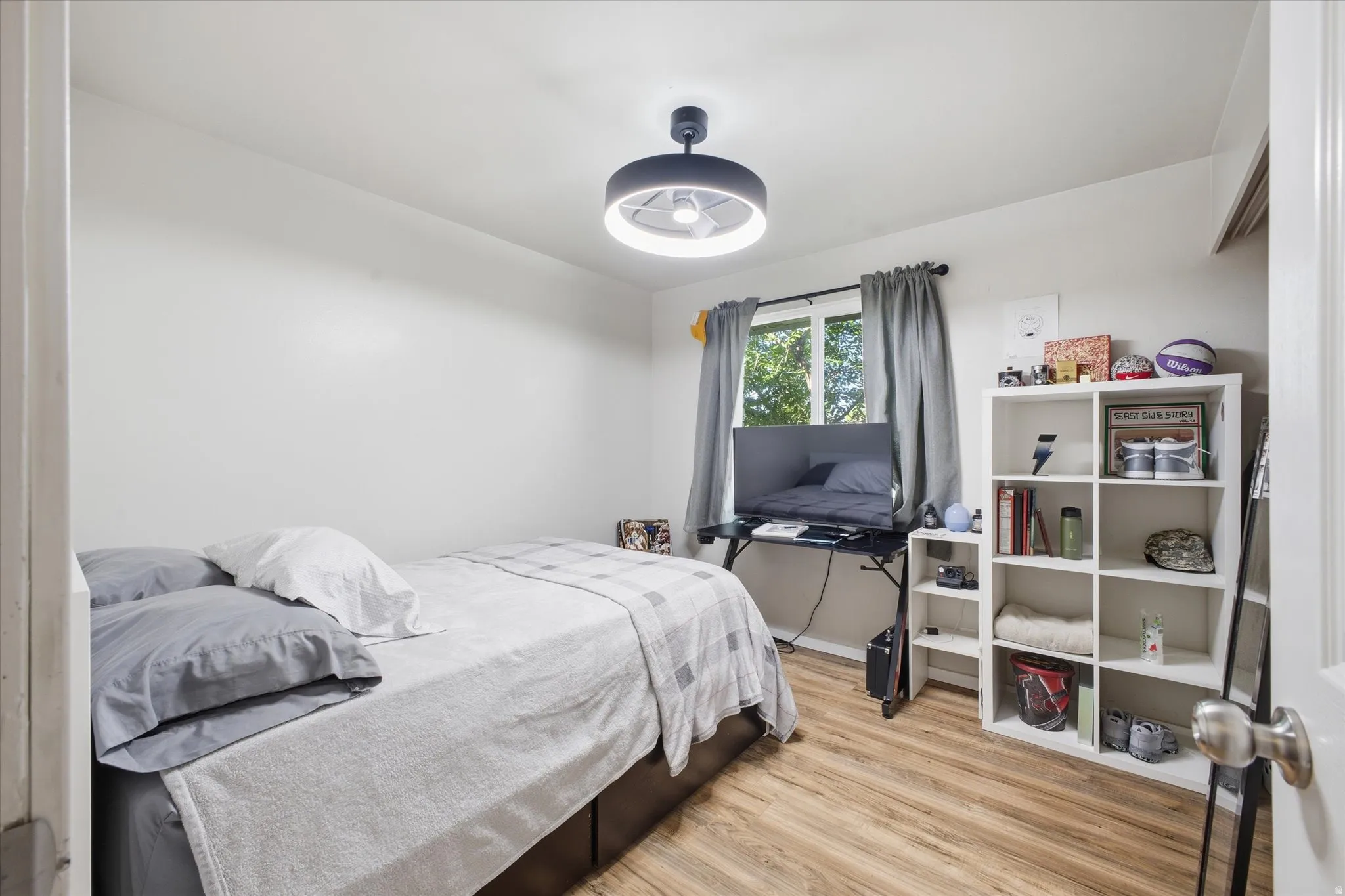 Bedroom with light wood-style flooring