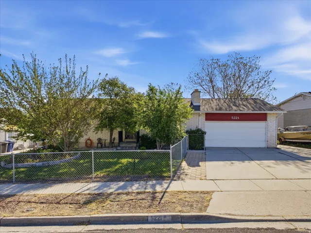 View of front of property featuring brick siding, and 2 car garage