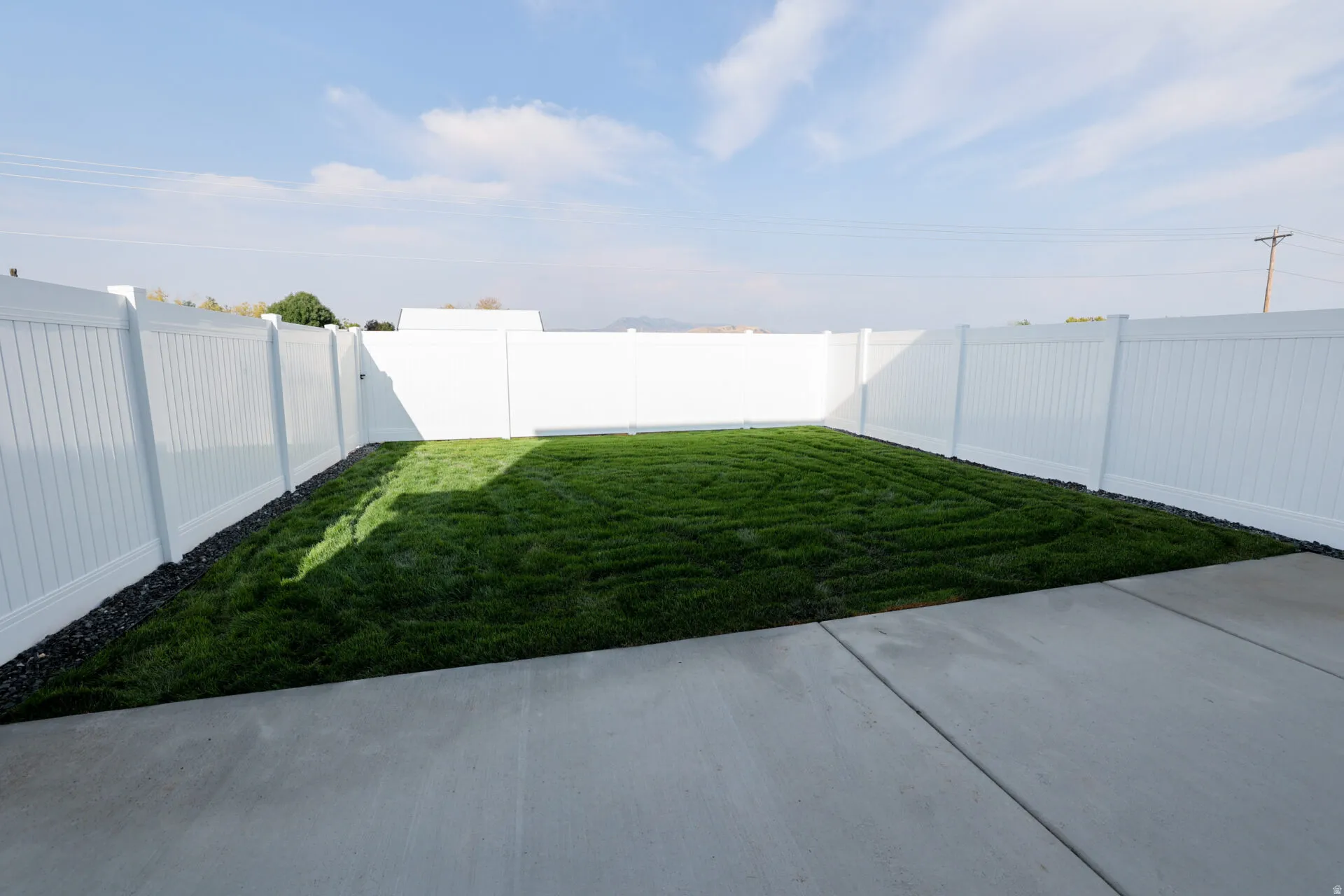 View of fenced backyard