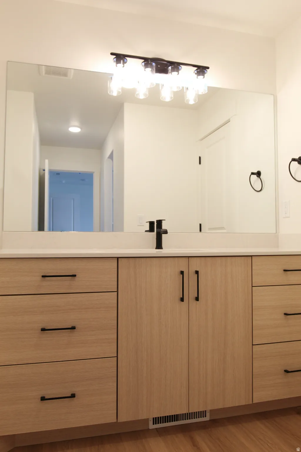 Bathroom featuring vanity and light wood-type flooring