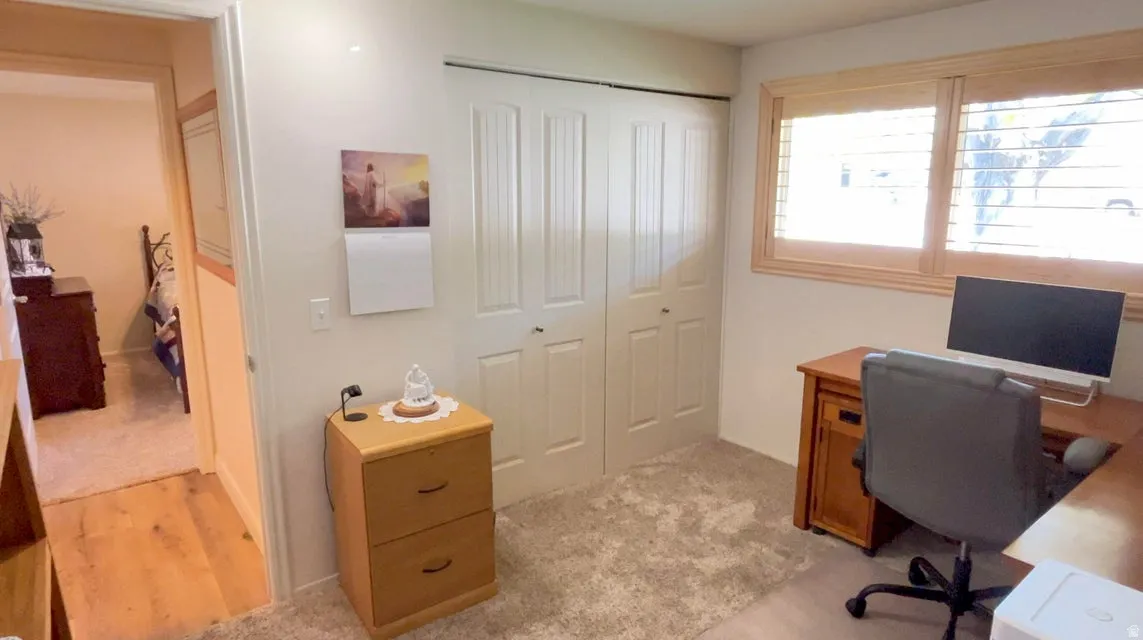 Home office with light carpet