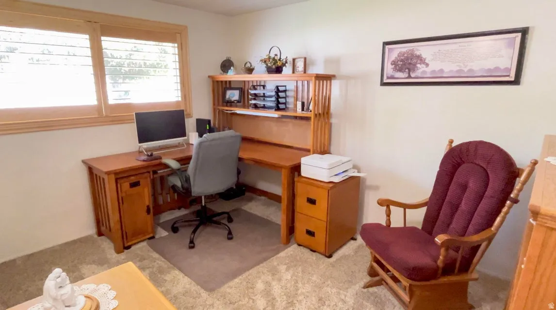Office area featuring light colored carpet