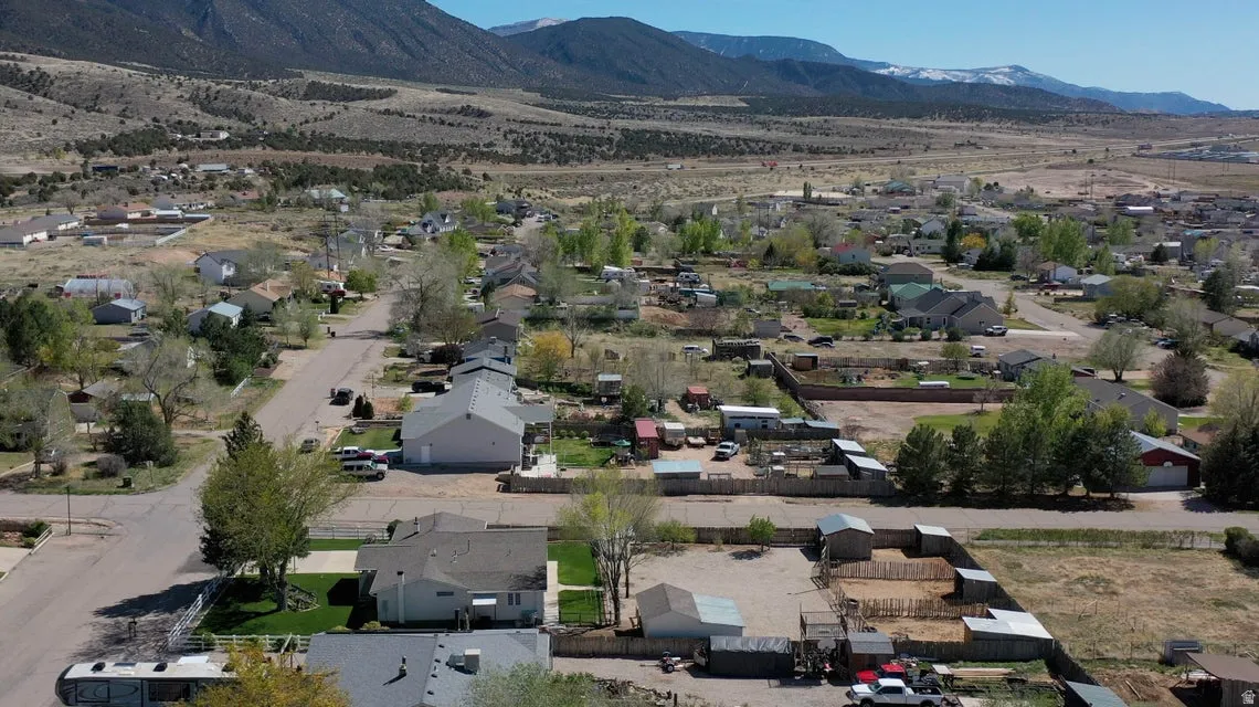 Aerial view of residential area featuring mountains