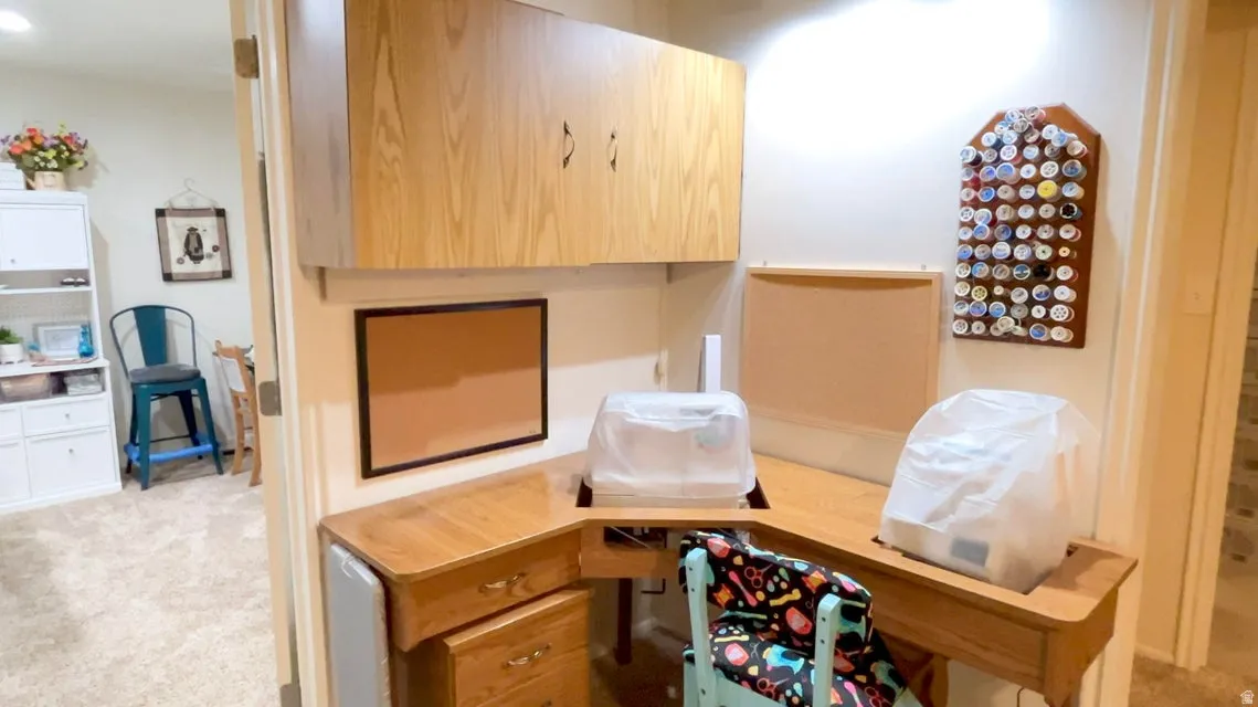 Detailed view of carpet floors and a desk