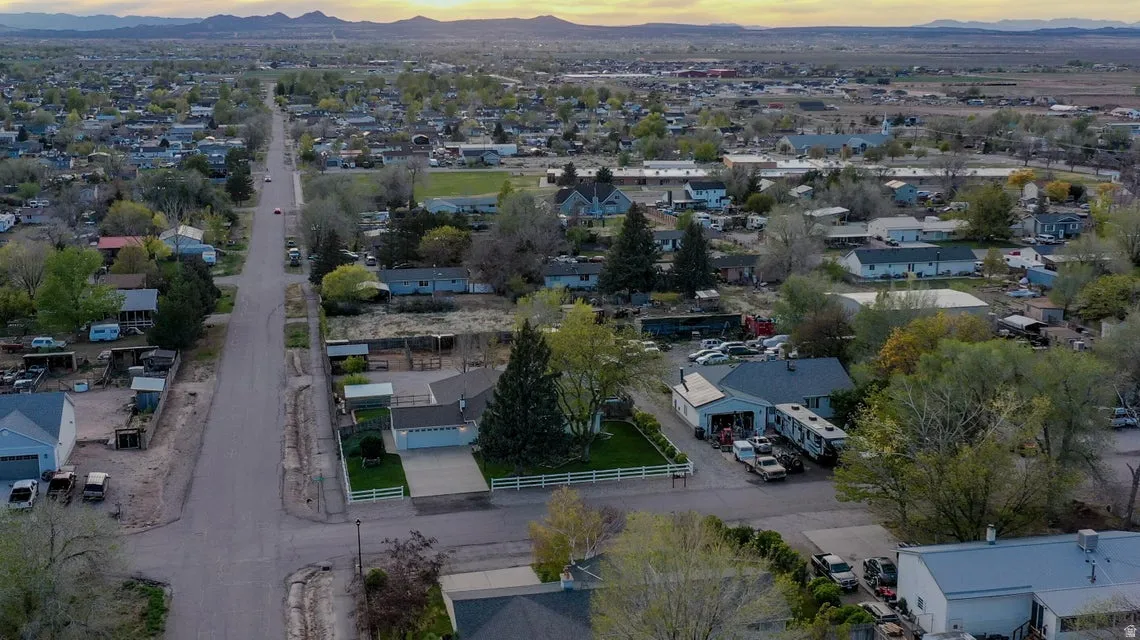 Aerial perspective of suburban area featuring a mountain backdrop